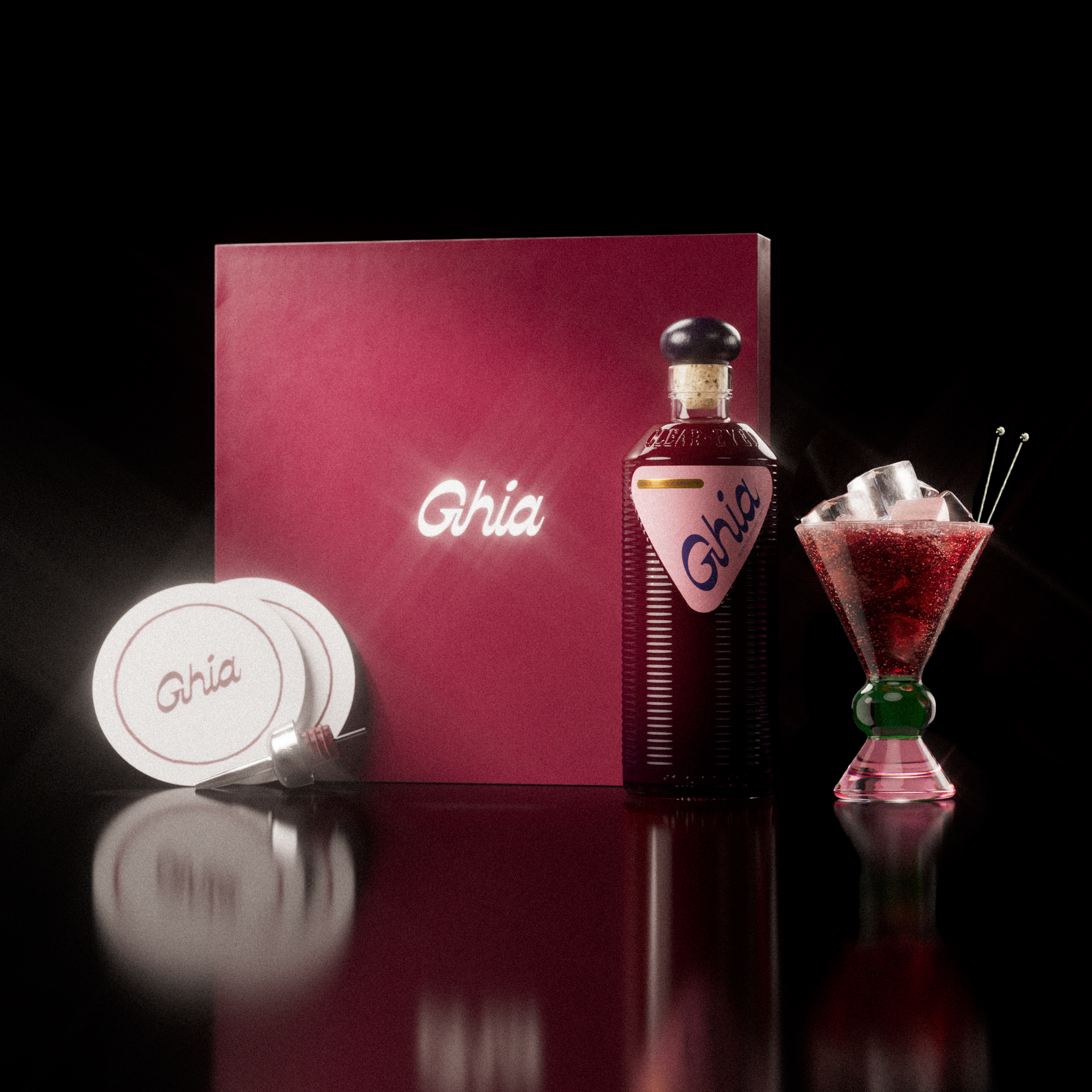 A Ghia non-alcoholic aperitif gift set with a burgundy box, paper coasters, 1 glass bottle of Berry Apéritif, and a decorative cocktail glass that has a green and pink base.