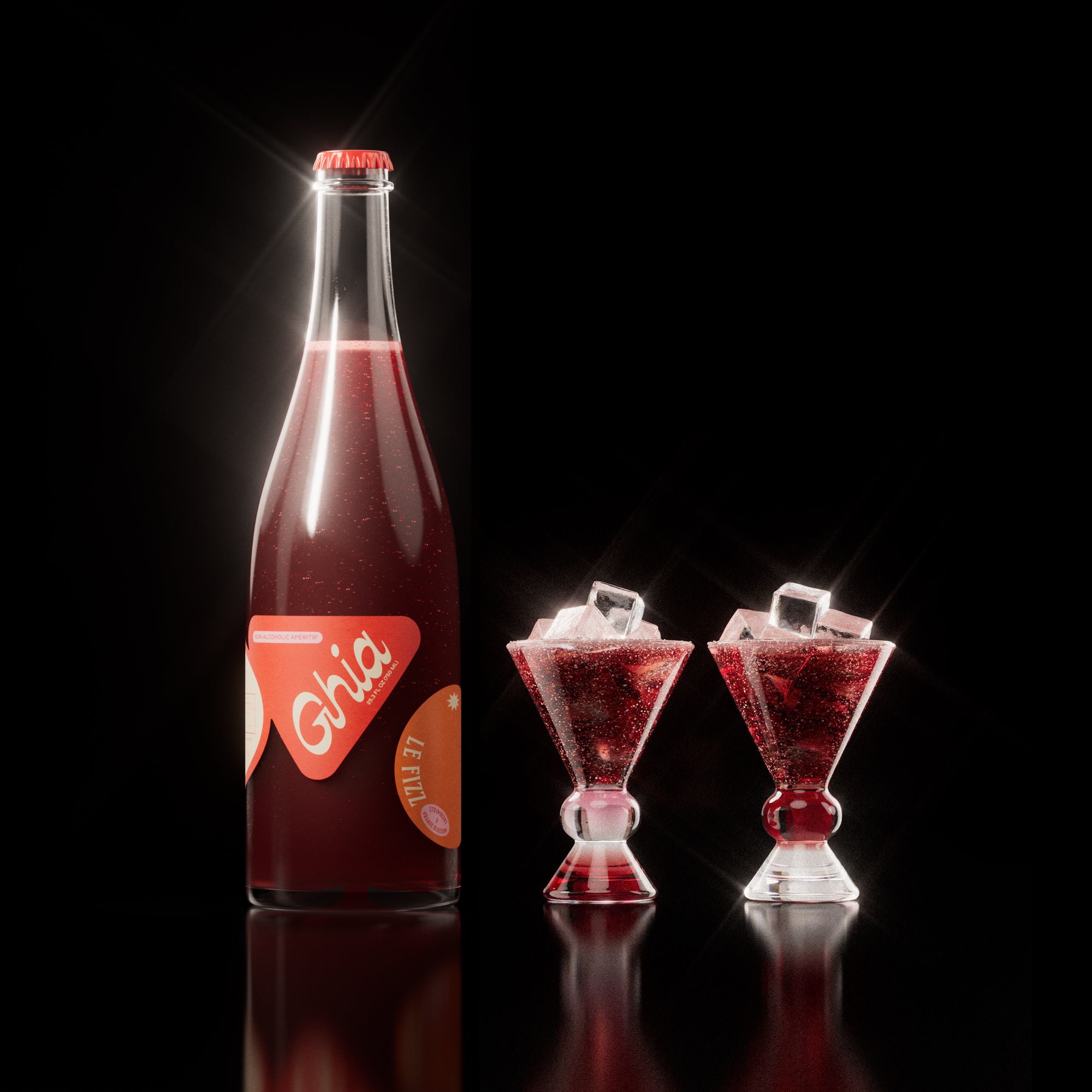 Non-alcoholic spritz in a bottle filled with a deep red strawberry and orange blossom beverage, featuring red labels. Alongside decorative cocktail glass that has a burgundy and clear base.