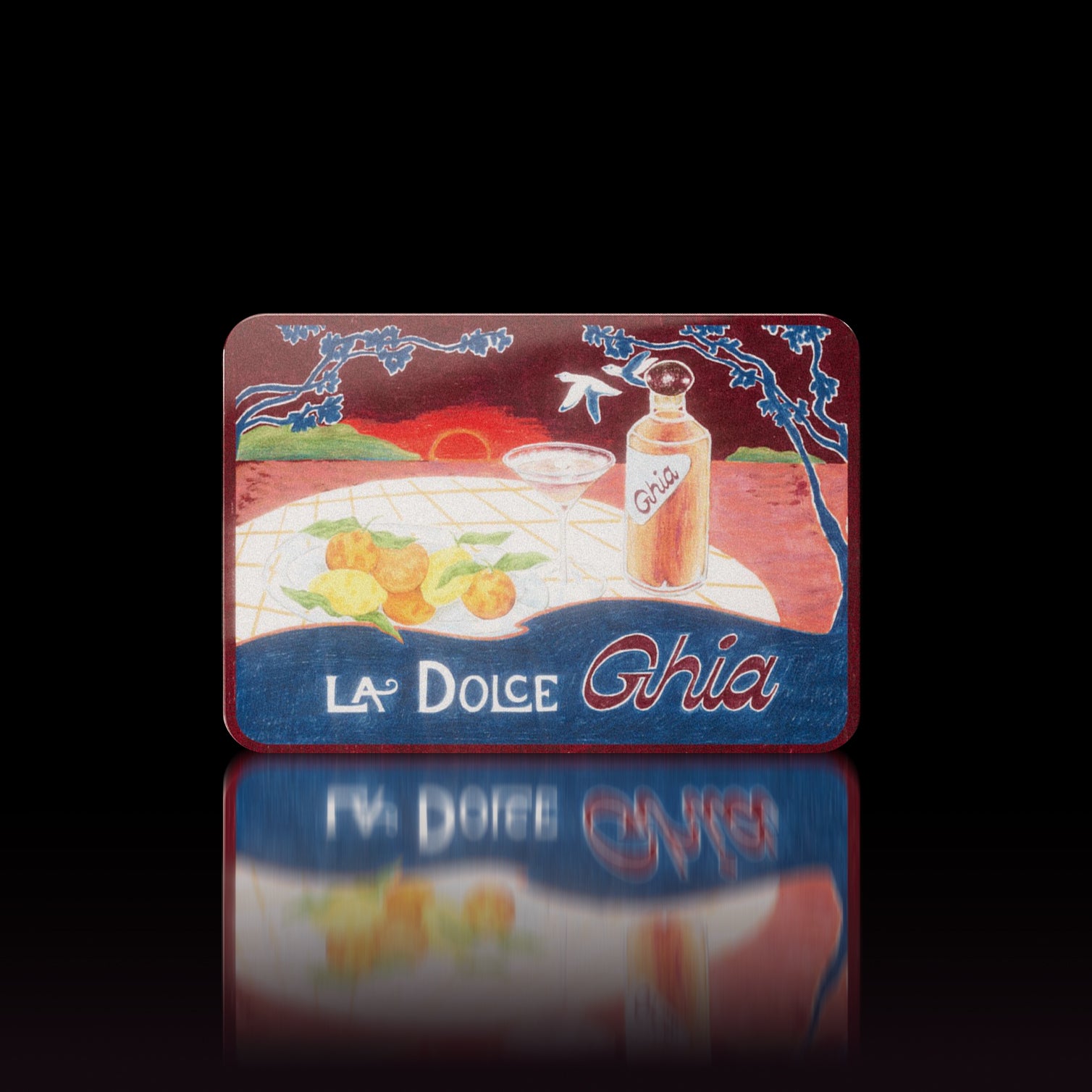 La Dolce Ghia illustrated tin showing a Ghia bottle, coupe and citrus on a sunset picnic table